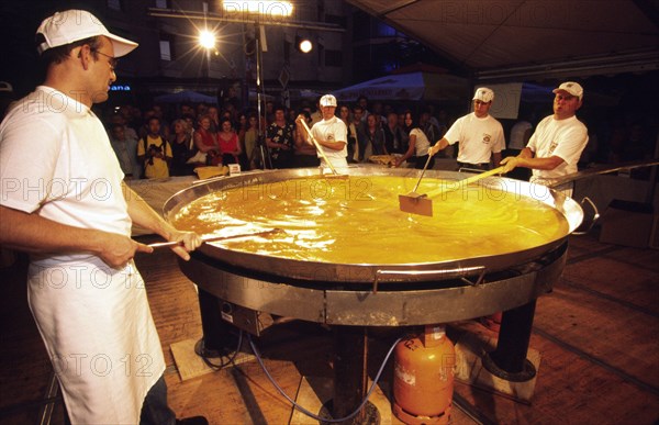 CROATIA, Istria, Buzet, "CrBuzet Subotina festival/giant omelette preparation. The highlight of the Buzet Subotina festival held every September, is the preparation of a giant truffle omelette using over two thousand eggs and ten kilos of truffles. The area around Buzet is one of Europe's prime locations for finding the gourmet fungus "