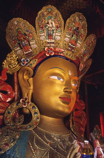 INDIA, Ladakh, Thikse Gompa, Maitreya Buddha the centrepiece of the monastery's newest temple is a serene Maitreya (future) Buddha. The temple's monks are of the Gelukpa order of Tibetan Buddhism