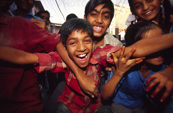 INDIA, Rajasthan, Udaipur, "Children celebrating Dussehra festival the ten day Dussehra festival is held at the end of the monsoon and celebrates the victory of the God Ram over the Demon King Ravana. For the final two days the streets and parks thrum to music, processions, fireworks and the ritual burning of giant effigies of the defeated Ravana."