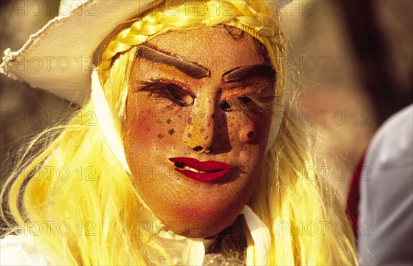 CROATIA, Kvarner, Rijeka, "Mask carnival, Gypsy accompanying Zvoncari pronounced Zvon-charee, the tradition of wearing frightening masks to drive away the evil spirits of winter pre-dates Christian times. In the weeks preceeding the main carnival, the Zvoncari parade the streets bearing clubs and jangling the heavy bells tied around their waists. Traditionally it is the men who fulfil the role, accompanied by other men dressed as gypsy girls in equally grotesque masks"