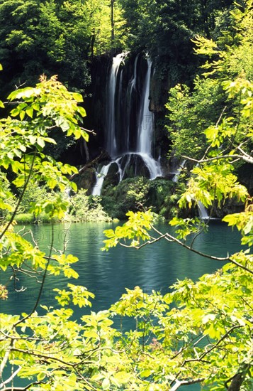 CROATIA, Lika, Plitvice, "Lakes, waterfall into Velika Jezero(Big lake). Part of the formation known as the upper lakes which filter down into Lake Kozjak, the largest of the Plitvice lakes"