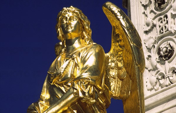 CROATIA, Zagreb, Cathedral gilded angel. Outside the cathedral stands a golden Madonna surrounded by angels sculpted by Antun Fernkor