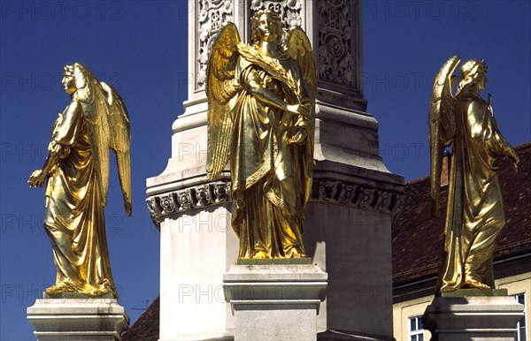 CROATIA, Zagreb, Cathedral statues of angels. Outside the cathedral stands Antun Fernkorn's gilded statues of four angels protecting the Madonna