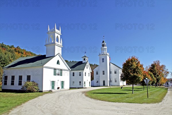 USA, New Hampshire, Washington, Whitc wooden church and autumn foliage.
