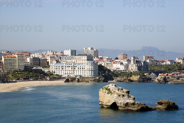 FRANCE, Aquitaine Pyrenees Atlantique, Biarritz, The Basque seaside resort on the Atlantic coast. The Grande Plage with the Bellevue Conference Centre in the middle and the Pyrenees mountains in the distance.