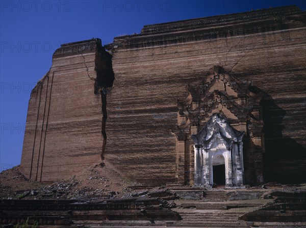 MYANMAR, Mingun, Mingun Paya exterior facade of unfinished pagoda begun in 1790 which suffered earthquake damage in 1938.