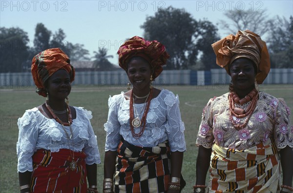 NIGERIA, People, Three-quarter portrait of three Ibo women dressed in traditional clothes for special occasion.