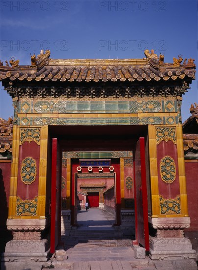 CHINA, Beijing, Forbidden City.  Looking through highly decorated sequence of doorways.