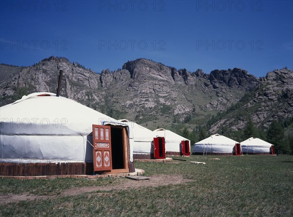 MONGOLIA, Architecture, Line of gers near in rocky landscape near Terelj.