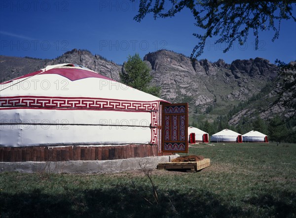 MONGOLIA, Architecture, Line of gers near in rocky landscape near Terelj.