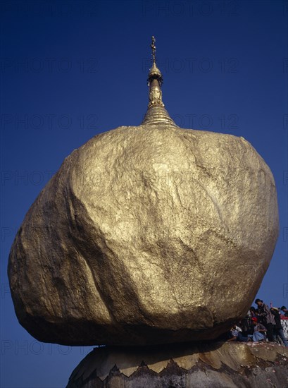 MYANMAR, Pegu, Kyaiktiyo Pagoda, "Worshippers at the Golden Rock Pagoda, historical Buddhist pilgrimage site"