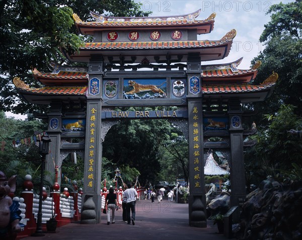 SINGAPORE, Haw Par Villa, Entrance to Haw Par Villa and Tiger Balm Gardens with people walking through below.