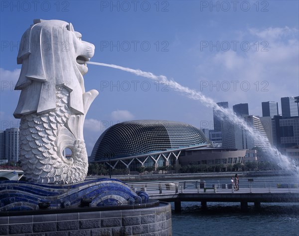 SINGAPORE, Merlion Park, Merlion statue and fountain in foreground with new esplanade concert hall behind.