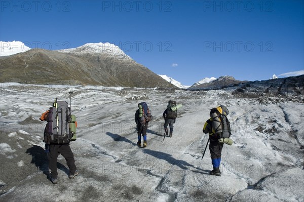 CHILE, Southern Patagonia, O'Higgins region , Mountaineers crossing Glacier Chico in the O'Higgins region of Patagonia. Trek from Glacier Chico (Chile) to El Chalten (Argentina)
