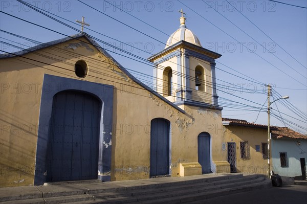 VENEZUELA, Caracas , "Church in colonial section of Petare, with telephone and power cables in the foreground."