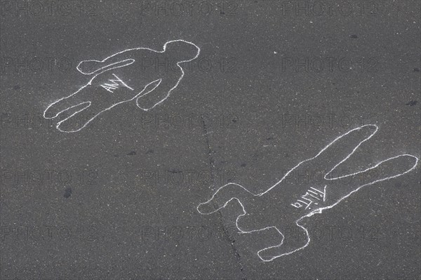 VENEZUELA, Caracas, Chalk outlines with the names of participants in an event on Avenida Francisco de Miranda to protest increasing levels of violence.