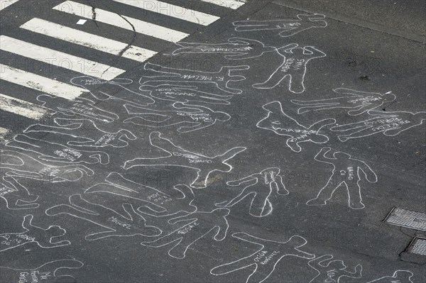 VENEZUELA, Caracas, Chalk outlines with the names of participants in an event on Avenida Francisco de Miranda to protest increasing levels of violence.