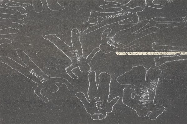 VENEZUELA, Caracas, Chalk outlines with the names of participants in an event on Avenida Francisco de Miranda to protest increasing levels of violence.