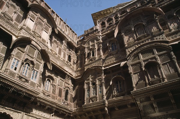 INDIA, Rajasthan, Jaisalmer, Patwon-ki-Haveli 1800-1860.  Sandstone house of wealthy merchant.  Part view of highly decorated exterior facade.