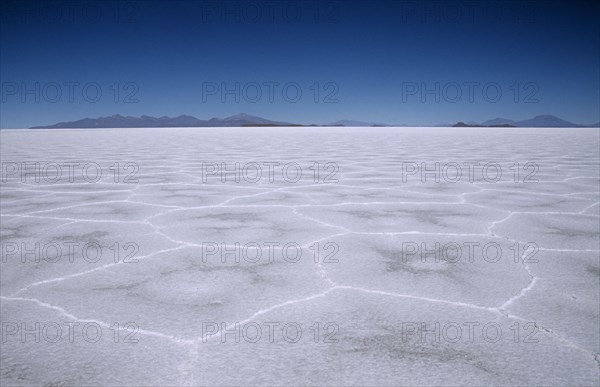 BOLIVIA, Potosi, Salar de Uyuni, Flat expanse of salt lake patterned with hexagonal shapes.