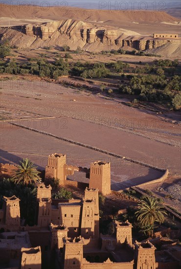 MOROCCO, Ait Benhaddou, Kasbah and hill town used in films such as Jesus of Nazareth and Lawrence of Arabia.  Looking down on sandstone buildings and surrounding landscape.