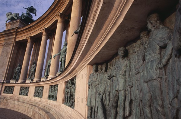 HUNGARY, Budapest, Heroes  Square erected to mark the 1000th anniversary of the Magyar conquest.  Statues and relief carving on semi circular colonnade of the Millennary Monument. Eastern Europe