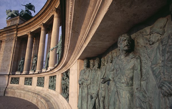 HUNGARY, Budapest, Heroes  Square erected to mark the 1000th anniversary of the Magyar conquest.  Statues and relief carving on semi circular colonnade of the Millennary Monument. Eastern Europe