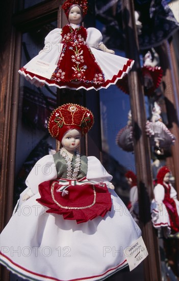 HUNGARY, Budapest, Handmade dolls in National costume for sale displayed outside shop window. Eastern Europe Store
