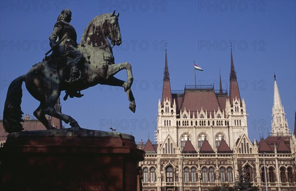 HUNGARY, Budapest, Parliament building with equestrian statue of Ferenc Rakoczi in foreground. Eastern Europe