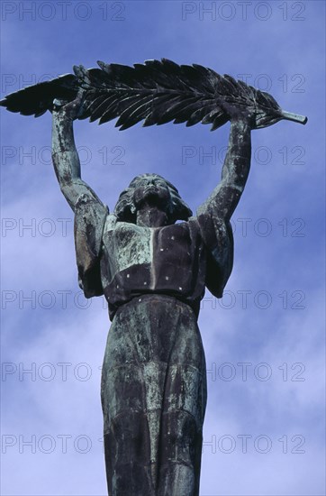 HUNGARY, Budapest, Soviet Liberation Monument on Gellert Hill. Detail of female figure holding aloft the palm of victory. Eastern Europe