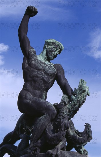 HUNGARY, Budapest, Gellert Hill.  Detail of statue of male figure slaying a multi headed serpant. Eastern Europe