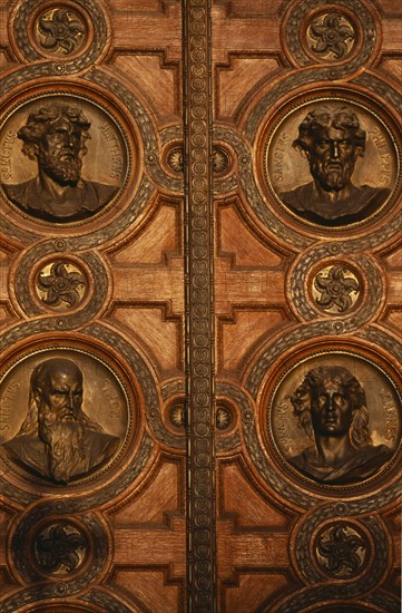 HUNGARY, Budapest, Basilica of St Stephen.  Detail of door with bronze relief carvings of the heads of the twelve apostles. Eastern Europe