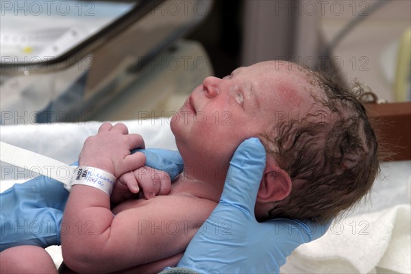 CHILDREN, Babies, Birth, "Kylan Stone, newborn baby girl being checked by nurse in hospital."