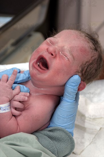 CHILDREN, Babies, Birth, "Kylan Stone, newborn baby girl being checked by nurse in hospital, crying."