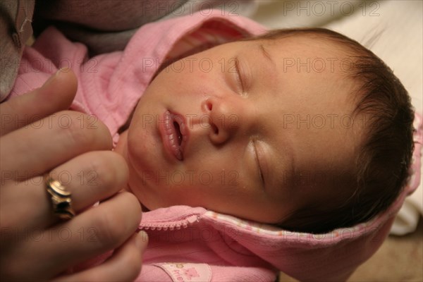 CHILDREN, Babies, Birth, "Kylan Stone, newborn baby girl holding mothers finger, 10 days old."