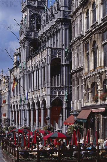 BELGIUM, Brabant, Brussels, Grand Place.  Maison du Roi.  Angled view of exterior with busy outside cafe in the foreground.
