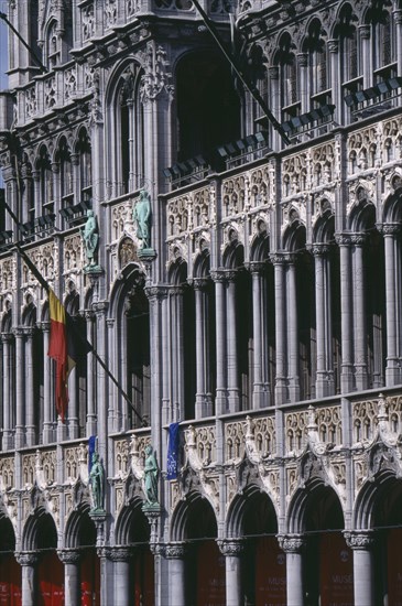 BELGIUM, Brabant, Brussels, Grand Place.  Maison du Roi.  Part view of exterior with carved  colonnade and statues.