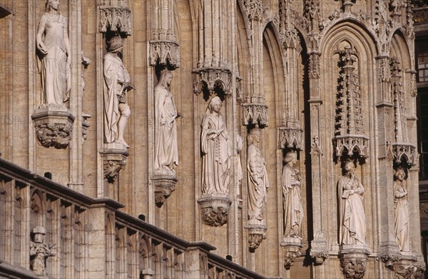 BELGIUM, Brabant, Brussels, Grand Place.  Hotel de Ville  detail of facade decorated with statues representing the Dukes and Duchesses of Brabant.  Stadhuis 15th Century