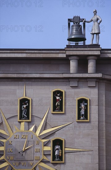 BELGIUM, Brabant, Brussels, Detail of building facade and Jacquemart clock.  Figures representing citizens of Brussels surround the clock face and move to announce the change of hour.