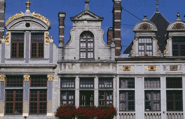 BELGIUM, Brabant, Brussels, Part view of building facades with gable rooftops and gilded decoration  balconies and flower filled window boxes.