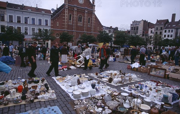 BELGIUM, Brabant, Brussels, "Flea Market. Place du Jeu de Balle, the Marolles. Street market selling china  glassware and bric-a-brac.   "