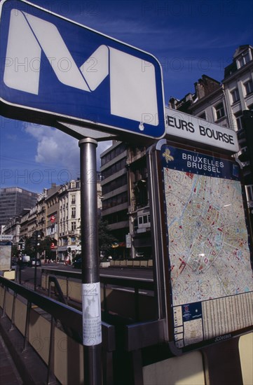 BELGIUM, Brabant, Brussels, Metro sign at subway entrance with attached poster of missing cat and city map displayed at side.