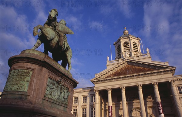 BELGIUM, Brabant, Brussels, Royal Square.  Exterior facade of Church of Saint James with equestrian statue of Godfrey of Bouillon leader of the first crusade in 1096 in foreground.