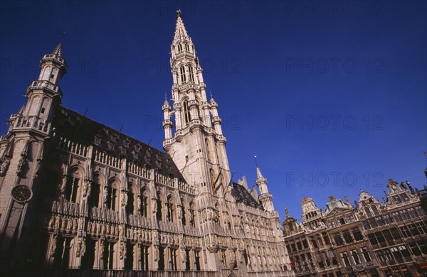 BELGIUM, Brabant, Brussels, The Grand Place.  Hotel de Ville.  Angled view of exterior facade decorated with statues representing the Dukes and Duchessess of Brabant.