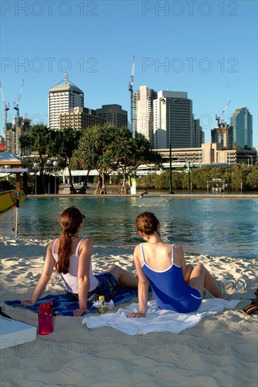 Australia, Queensland, Brisbane, Sunbathers in the Southbank Complex - Brisbane