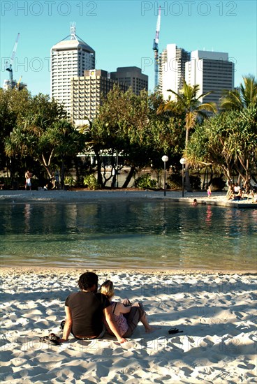 Australia, Queensland, Brisbane, Sunbathers in the Southbank Complex - Brisbane