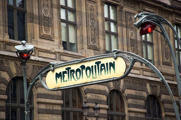 FRANCE, Ile de France, Paris, The Art Nouveau Metropolitain sign at the Palais Royale Musee du Louvre metro station beside the Louvre Museum in Place du Palais Royale