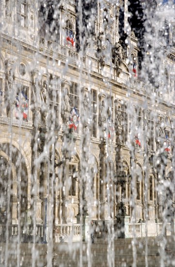 FRANCE, Ile de France, Paris, "The Hotel de Ville, Town Hall, seen through water rising from a fountain"