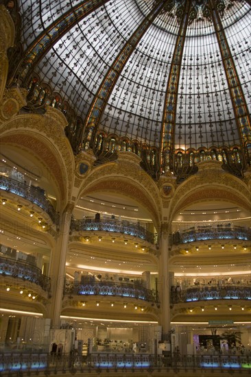 FRANCE, Ile de France, Paris, Opera Quarter. The central circular area under the glass dome of the Art Nouveau department store Galleries Lafayette