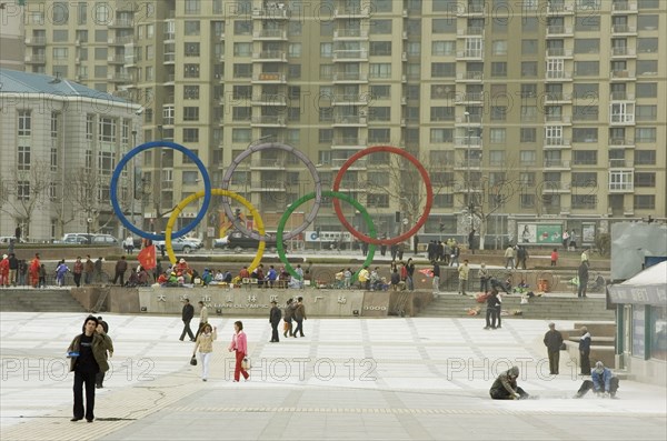 CHINA, Liaoning, Dalian, Repairing square in downtown Dalian displaying Olympic symbol